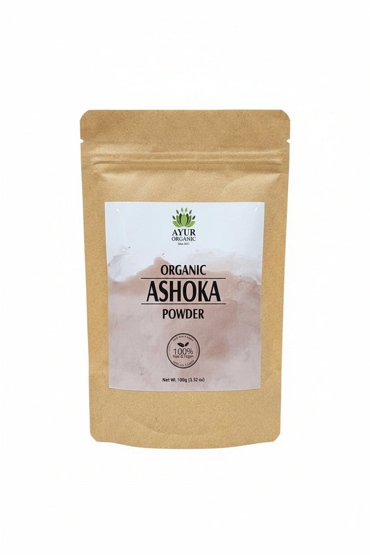 Kraft paper packaging with a white label for Ashoka Organic Powder on a brown surface.