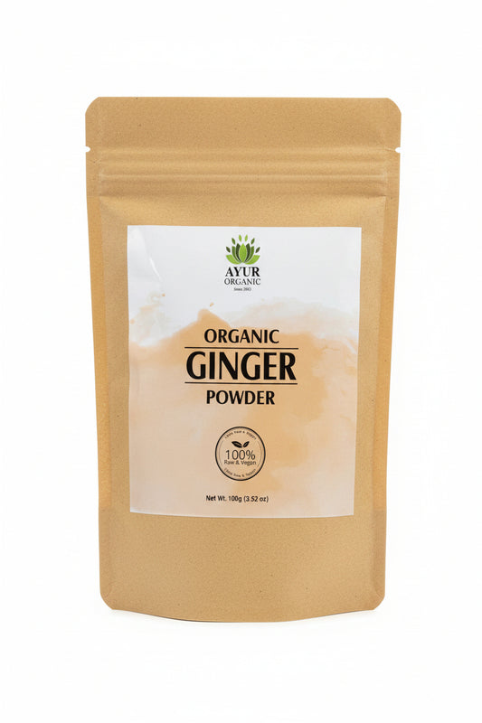 Bag of organic ginger powder with a brand label on a wooden surface
