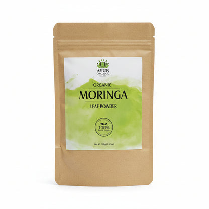 Moringa powder package on a cardboard surface